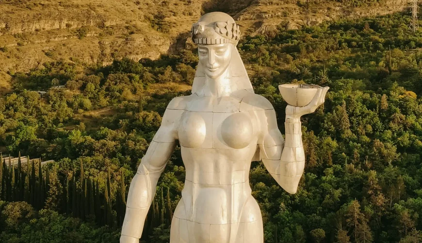A detailed close-up of the Kartlis Deda (Mother of Georgia) statue in Tbilisi, highlighting her features and the symbolic sword and bowl she holds.
