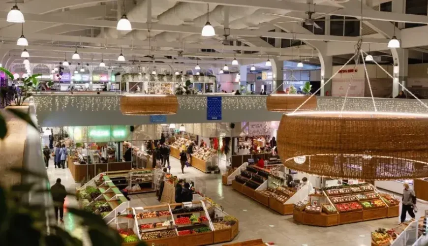 An aerial shot of the interior of Bazari Orbeliani in Tbilisi, with modern and clean market stalls selling fresh produce and goods
